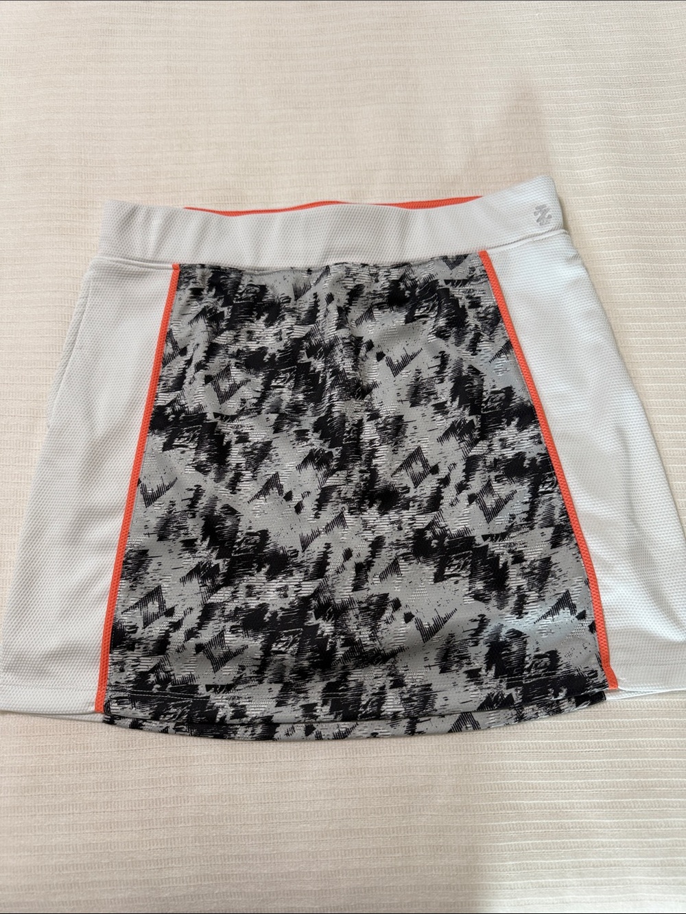 Golf Athletic Mini Skirt in White with Black Pattern and Coral Trim